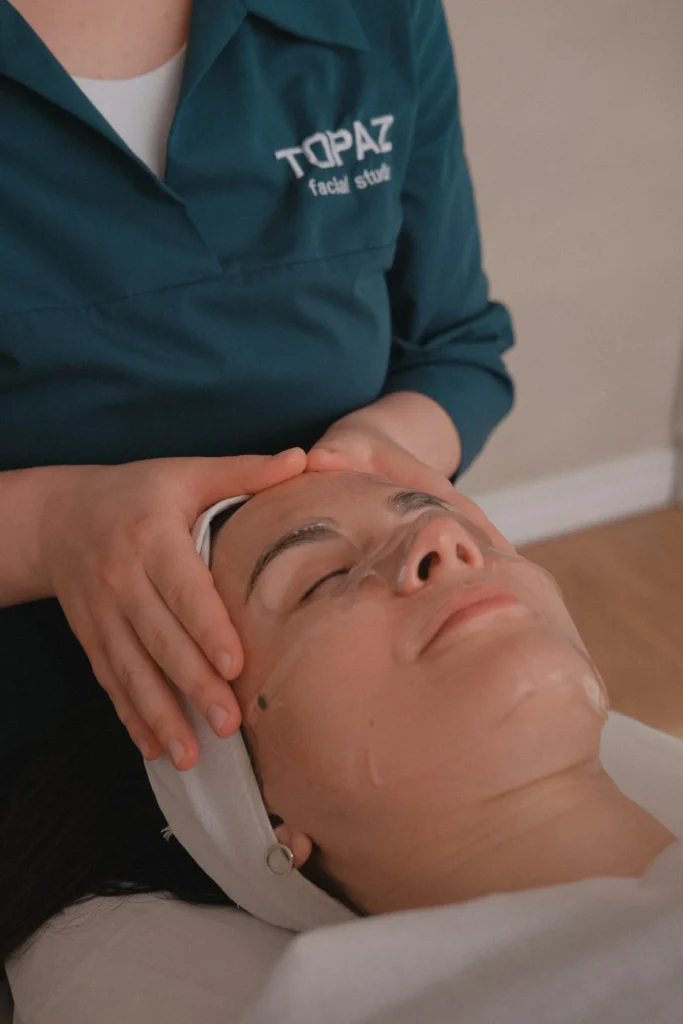 Client receiving a relaxing manual facial massage.