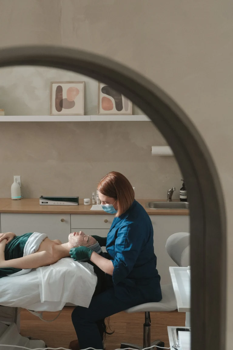 Anna Koshevaia working with a client in the treatment room