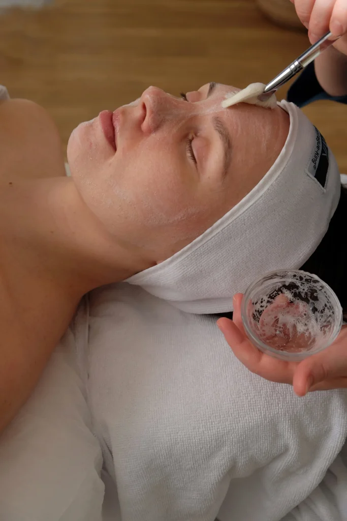 Facial specialist applying a customized skincare treatment