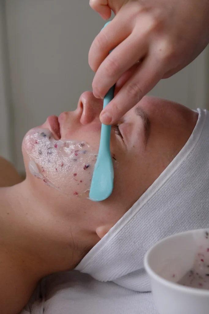 Professional facial solution being applied with a spatula.