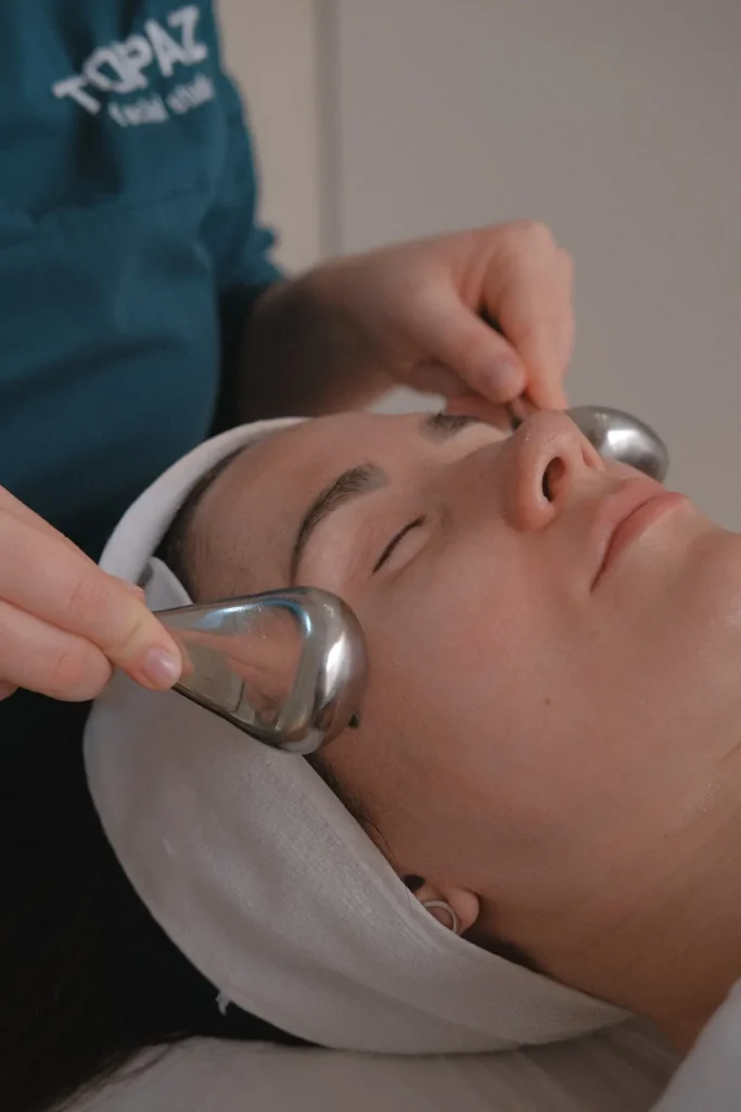 Close-up of a facial device used during a cleansing treatment.