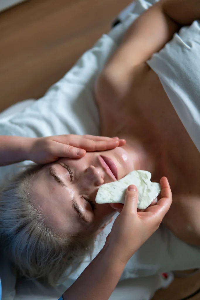Close-up of a hands-on facial massage technique.